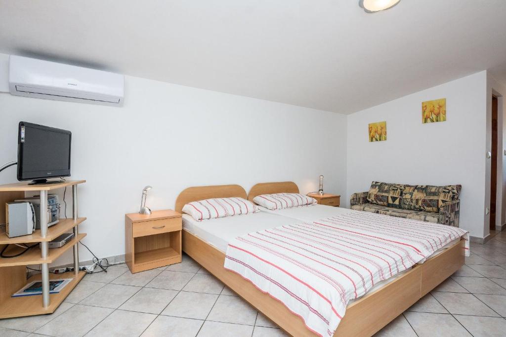 Posteľ alebo postele v izbe v ubytovaní Apartments Delic Pejic