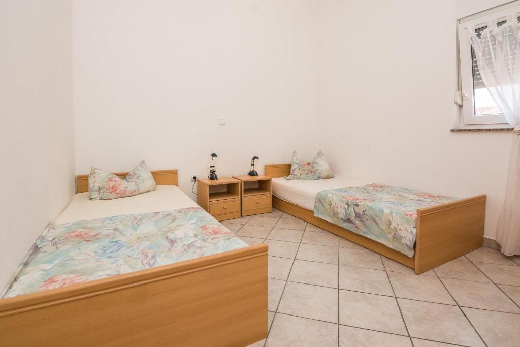 Posteľ alebo postele v izbe v ubytovaní Apartments Delic Pejic