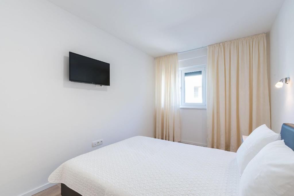 Postel nebo postele na pokoji v ubytování Apartment Martan