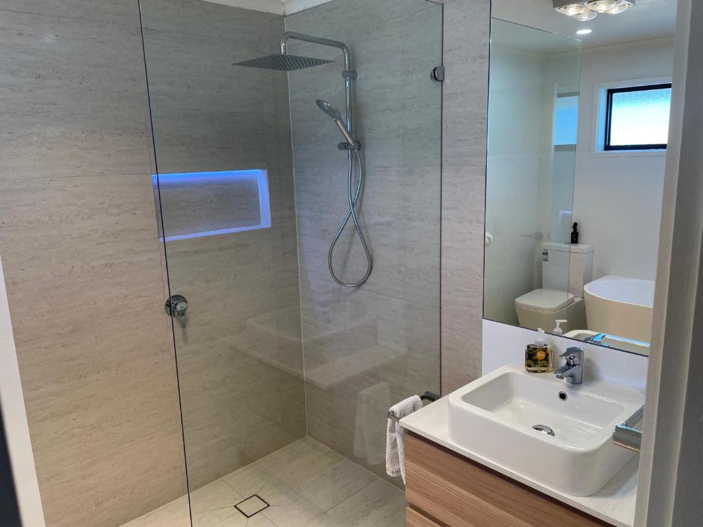 a bathroom with a shower and a sink at Port Relaxation in Portarlington