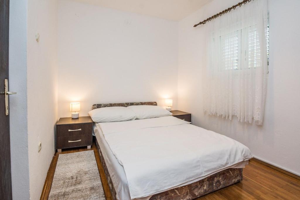 Postel nebo postele na pokoji v ubytování Apartments Napros