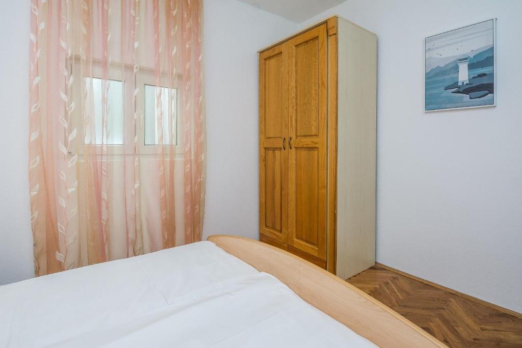Postel nebo postele na pokoji v ubytování Apartments Napros