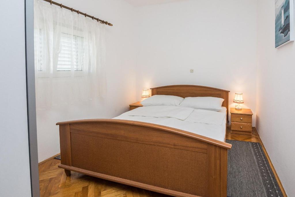 Postel nebo postele na pokoji v ubytování Apartments Napros