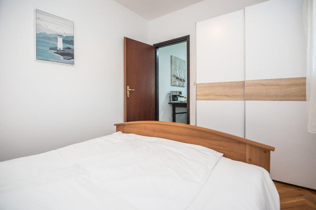 Postel nebo postele na pokoji v ubytování Apartments Napros