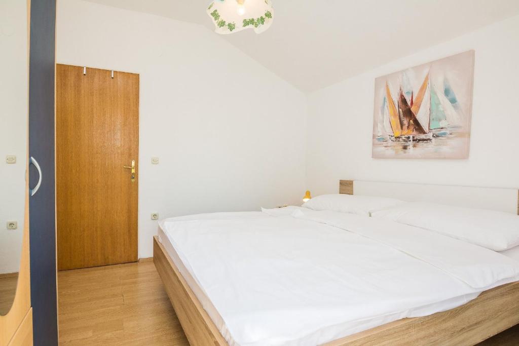 Postel nebo postele na pokoji v ubytování Apartments Napros