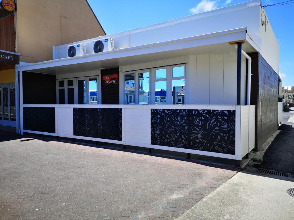 a building with a gate in front of it at The Runaway in Dargaville