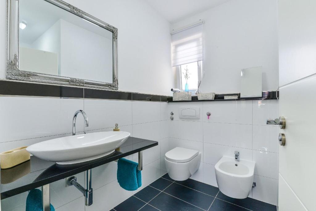 Kúpeľňa v ubytovaní Apartments Olujic