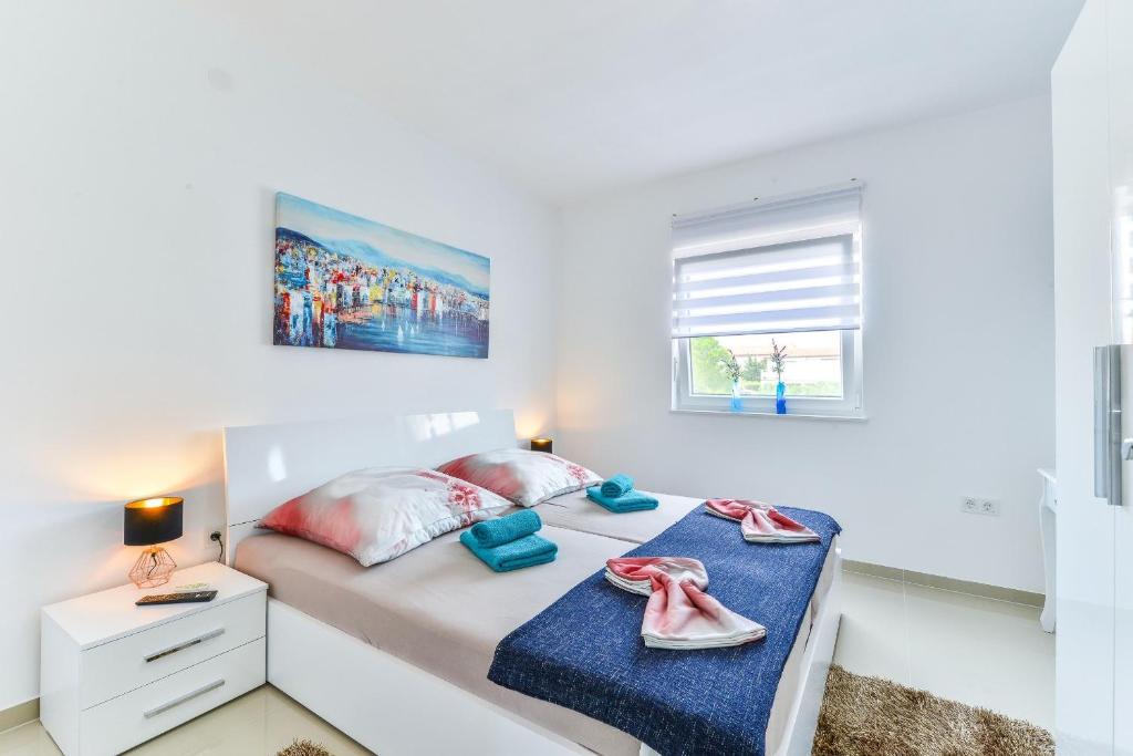 Posteľ alebo postele v izbe v ubytovaní Apartments Olujic
