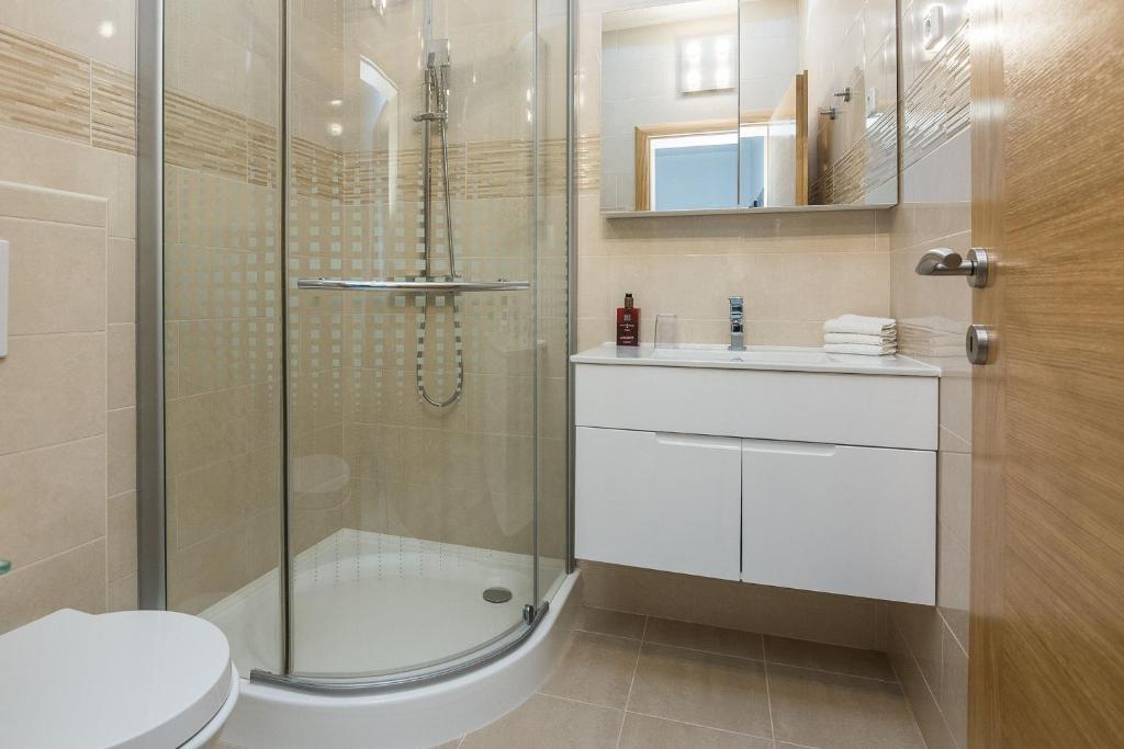 Kúpeľňa v ubytovaní Apartments Kosic