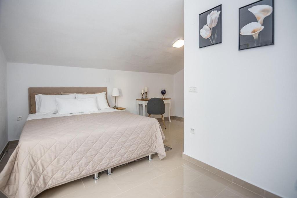 Posteľ alebo postele v izbe v ubytovaní Apartments Kosic