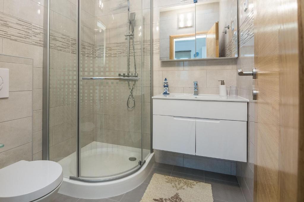 Kúpeľňa v ubytovaní Apartments Kosic