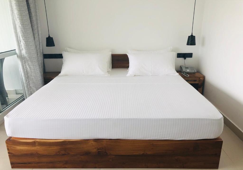 Postel nebo postele na pokoji v ubytování Atteriya SIGIRIYA