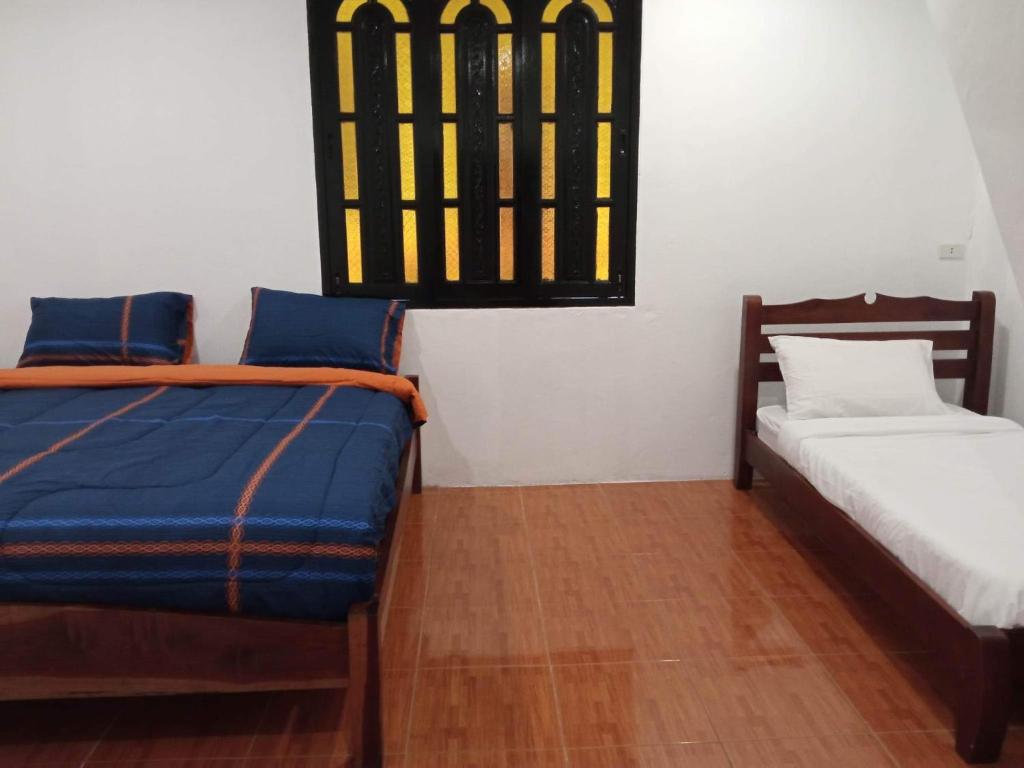 Postel nebo postele na pokoji v ubytování Divers House
