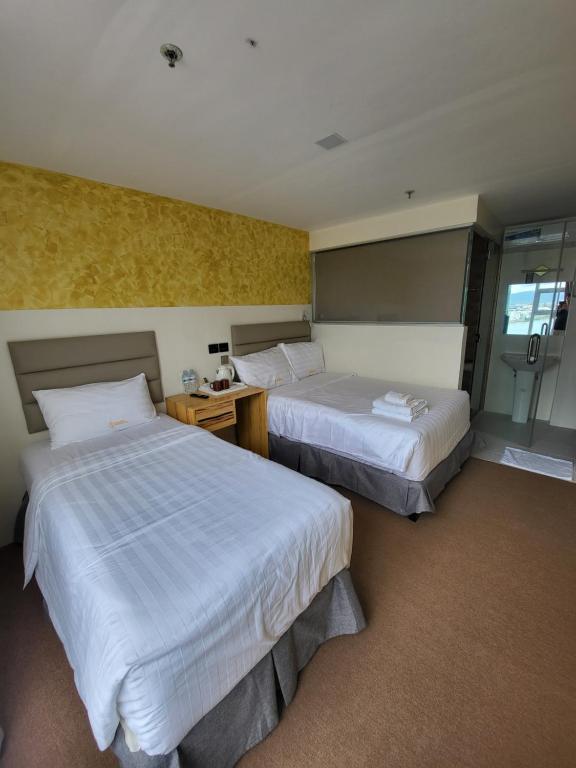 Cama o camas de una habitación en Sempre Premier Inn - MACTAN AIRPORT HOTEL