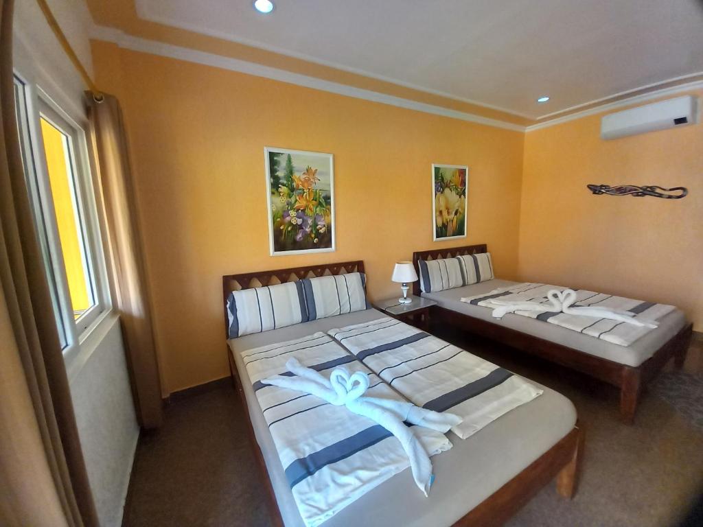 Postel nebo postele na pokoji v ubytování Malapascua Garden Resort