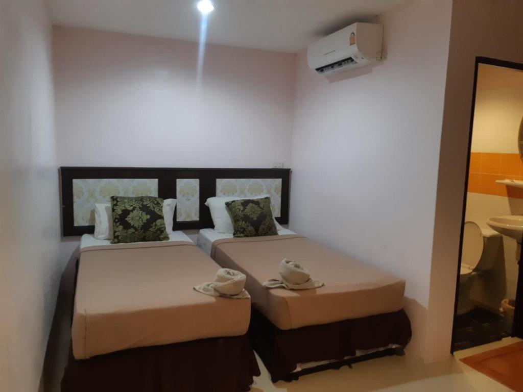 Postel nebo postele na pokoji v ubytování Sabai House