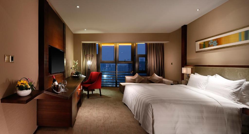 Postel nebo postele na pokoji v ubytování Lia Charlton Hotel Shenzhen