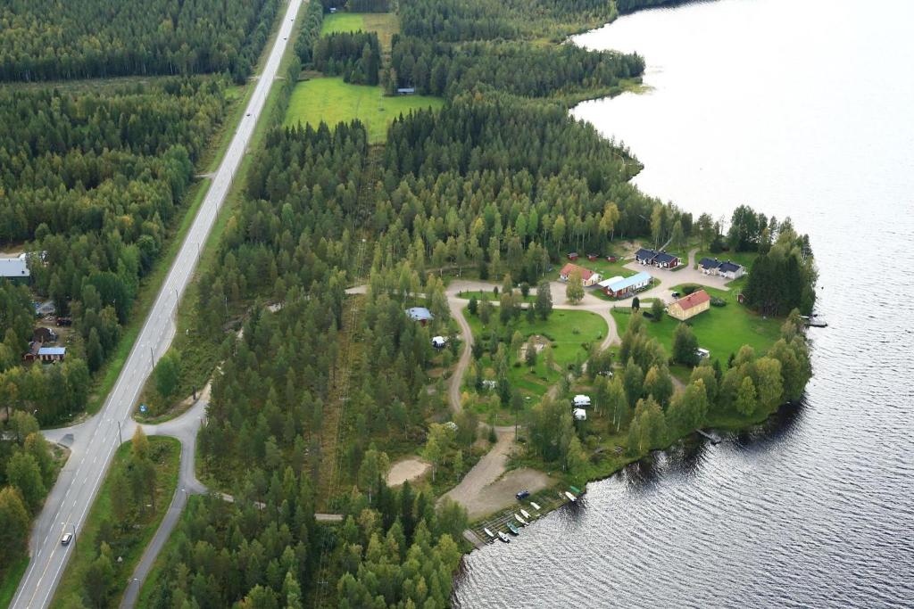 an aerial view of an island in the water at Ristijärven Pirtti Cottage Village in Ristijärvi