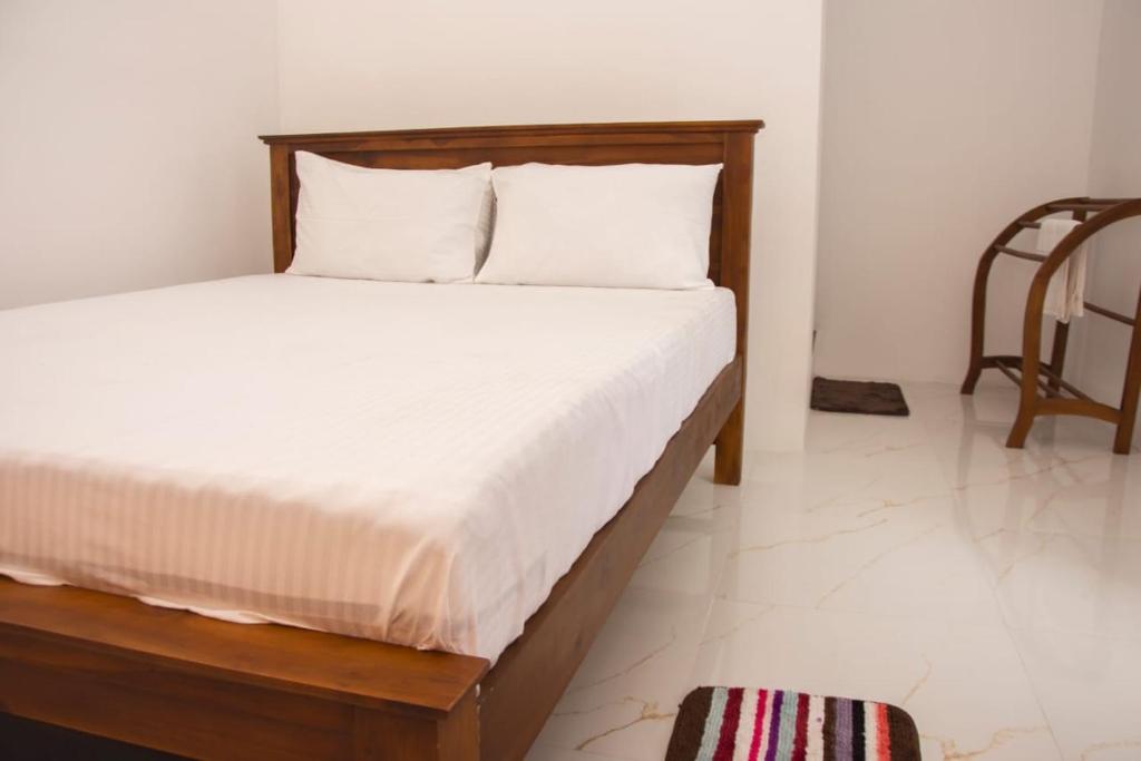 Postel nebo postele na pokoji v ubytování Sanmi Airport Resort