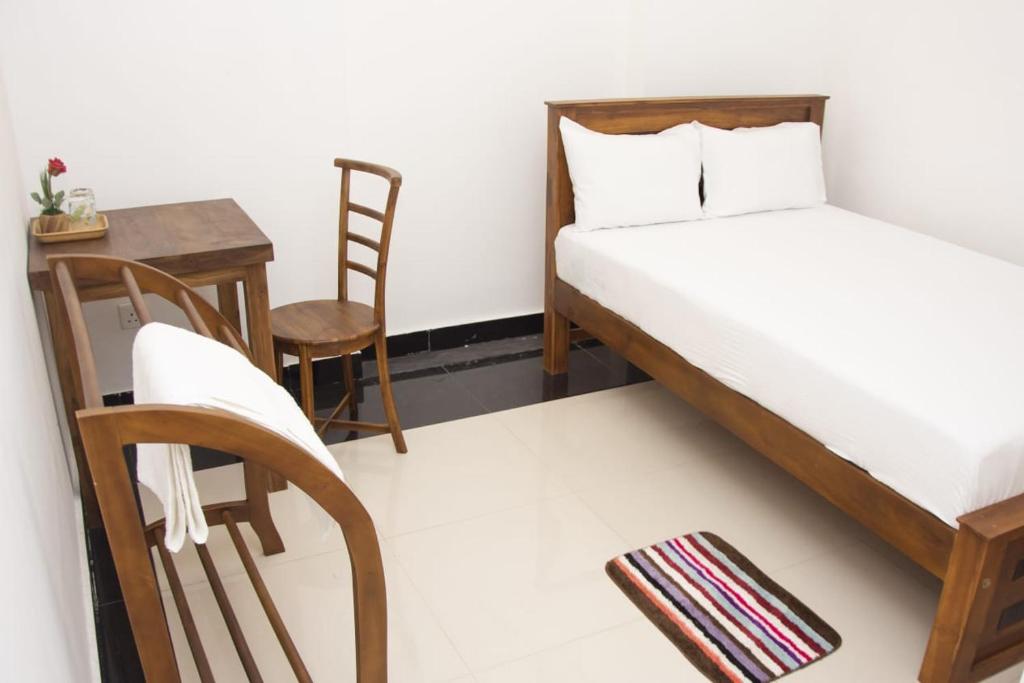 Postel nebo postele na pokoji v ubytování Sanmi Airport Resort