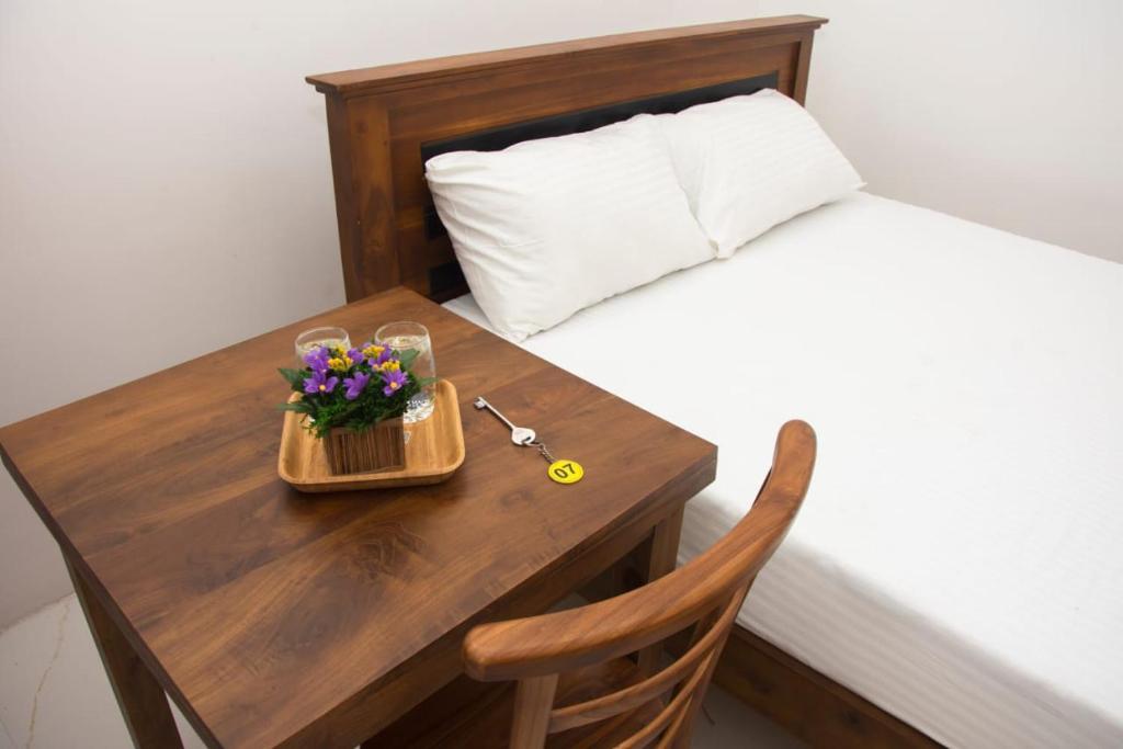 Postel nebo postele na pokoji v ubytování Sanmi Airport Resort