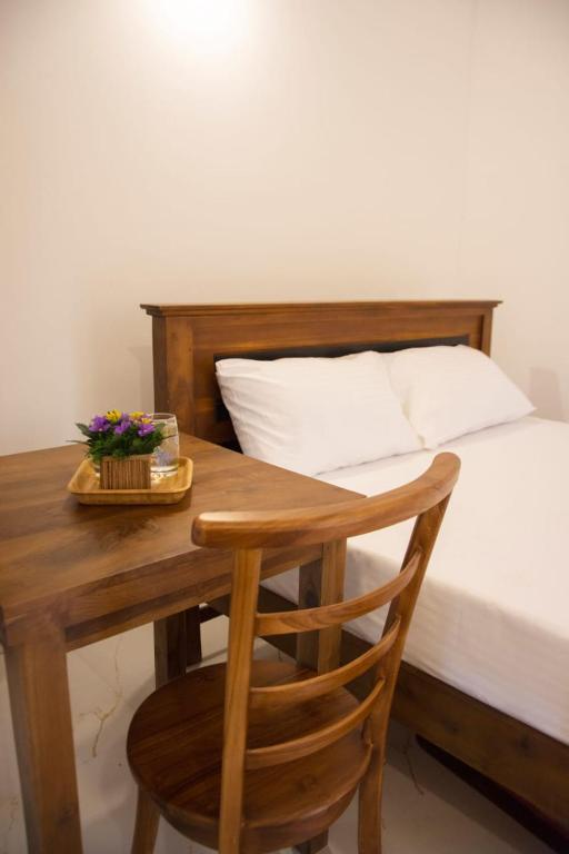 Postel nebo postele na pokoji v ubytování Sanmi Airport Resort