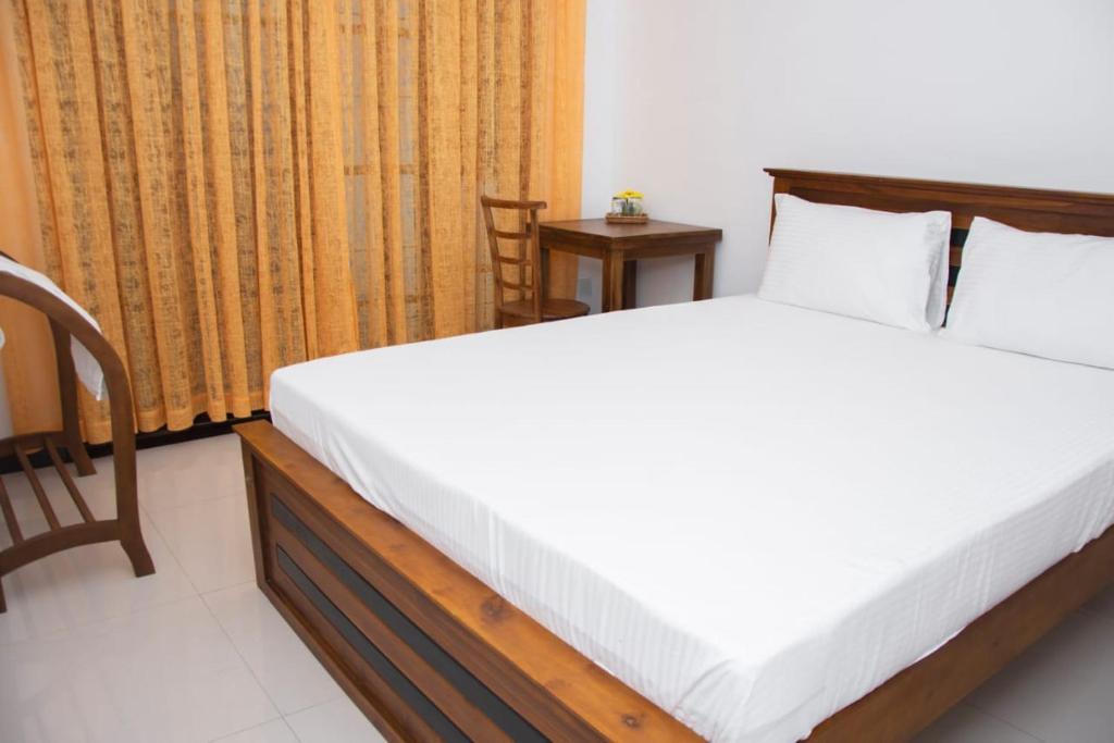 Postel nebo postele na pokoji v ubytování Sanmi Airport Resort