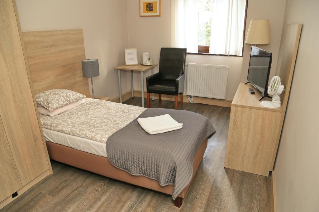 Posteľ alebo postele v izbe v ubytovaní B & B Tomula