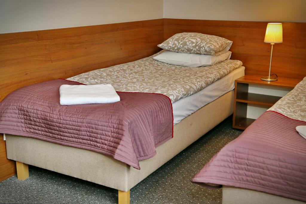 Posteľ alebo postele v izbe v ubytovaní B & B Tomula