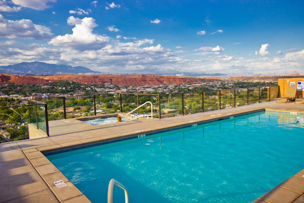 a swimming pool with a view of theichita mountains at Inn On The Cliff in St. George