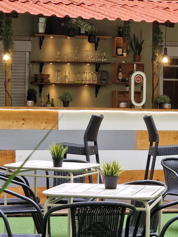 a restaurant with tables and chairs in front of a counter at Castilho 63 Hostel & Suites in Lisbon