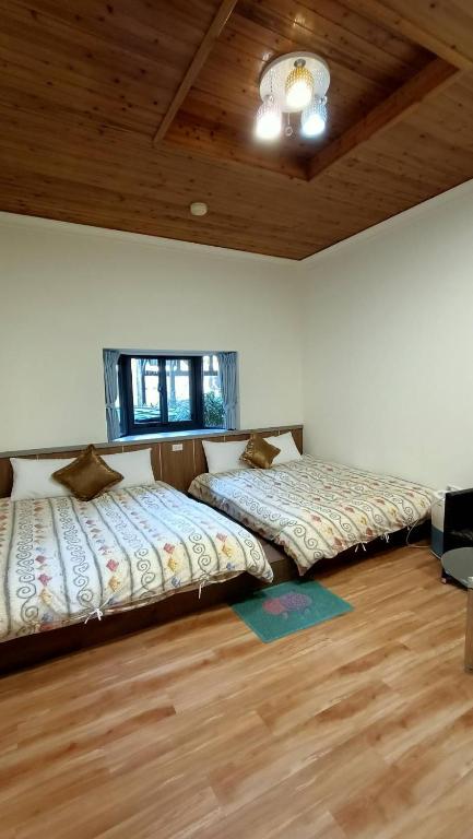 Postel nebo postele na pokoji v ubytování Xitou Tianpin Homestay