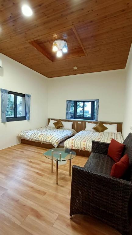 Postel nebo postele na pokoji v ubytování Xitou Tianpin Homestay