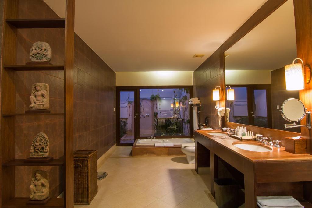 a bathroom with two sinks and a large mirror at Palace Residence & Villa Siem Reap in Siem Reap