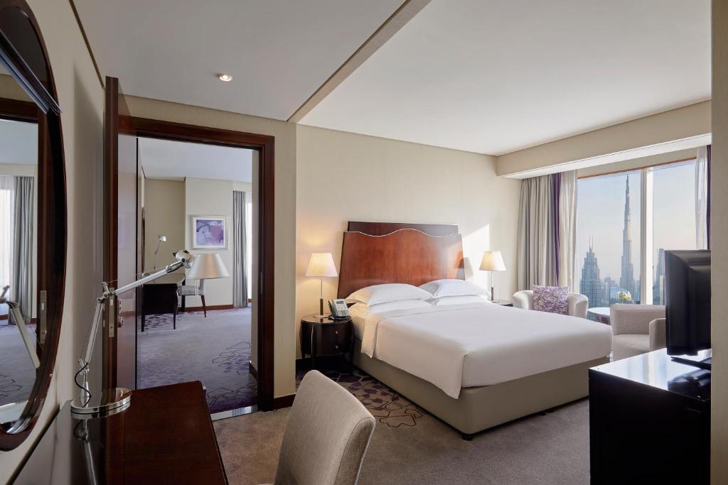 Postel nebo postele na pokoji v ubytování Rose Rayhaan by Rotana - Dubai