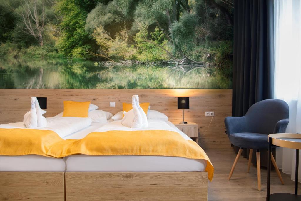 Posteľ alebo postele v izbe v ubytovaní Gyirmót Sport & Wellness Hotel