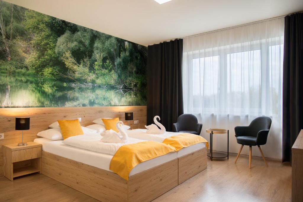 Posteľ alebo postele v izbe v ubytovaní Gyirmót Sport & Wellness Hotel