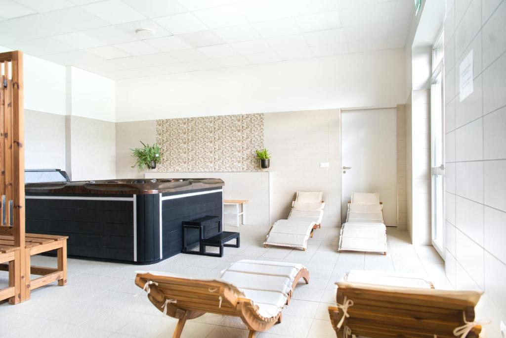Posedenie v ubytovaní Gyirmót Sport & Wellness Hotel