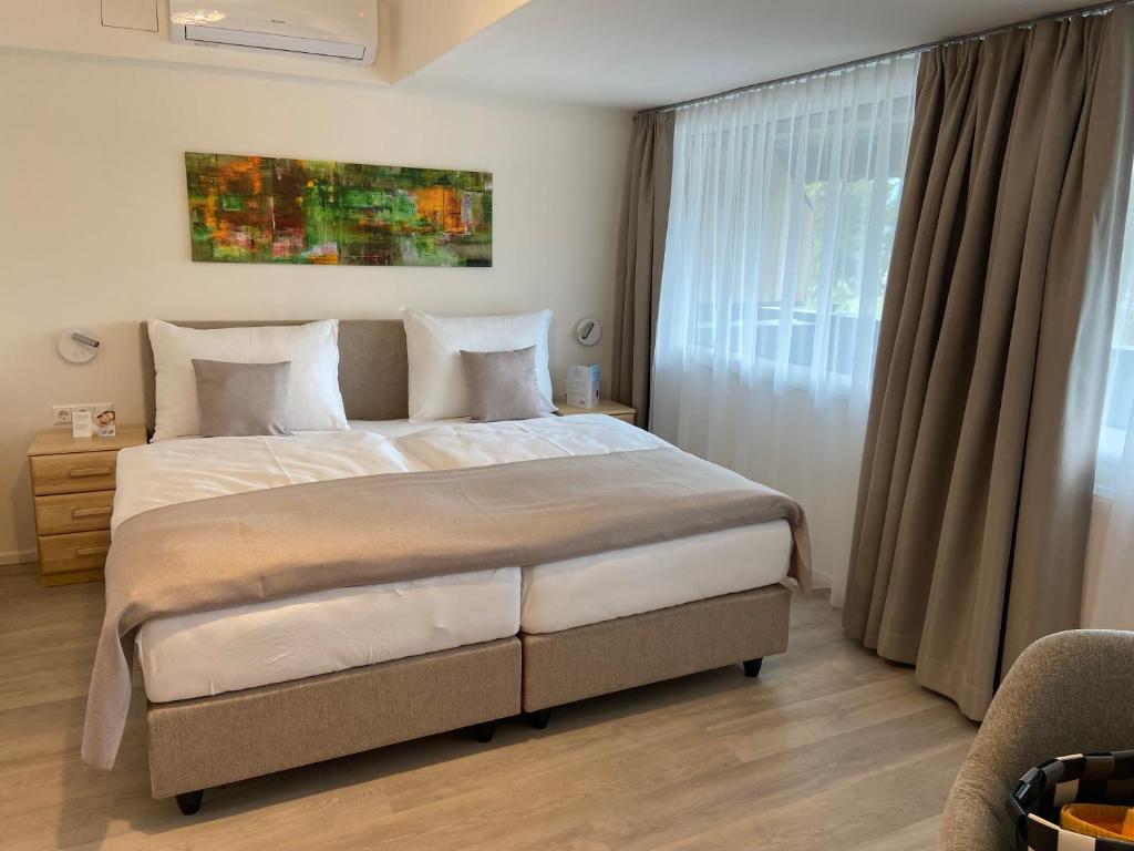 Postel nebo postele na pokoji v ubytování Landhotel Rosentaler Hof