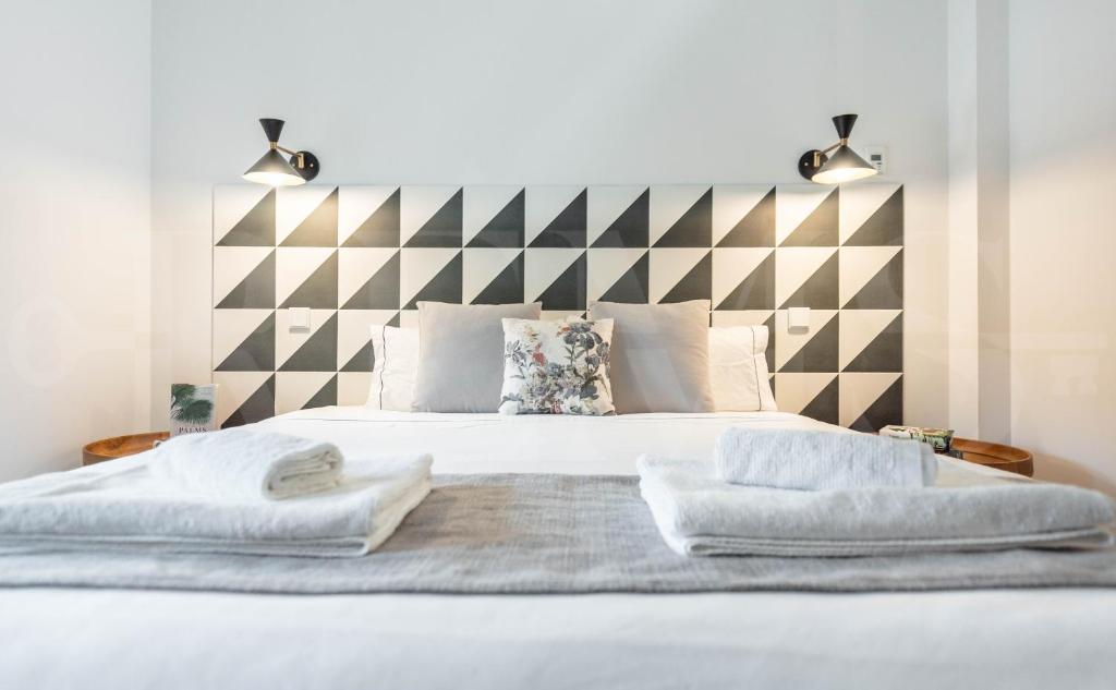 Posteľ alebo postele v izbe v ubytovaní Penthouse with private rooftop in the heart of Malaga by REMS