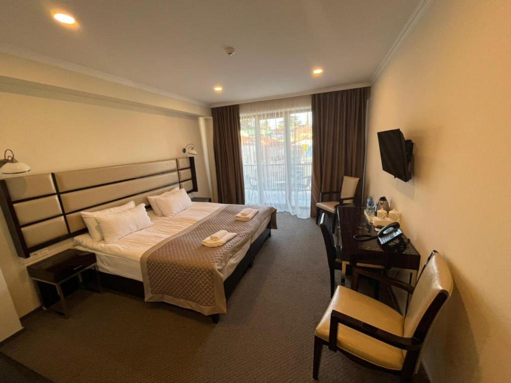 Postel nebo postele na pokoji v ubytování Hotel Genio