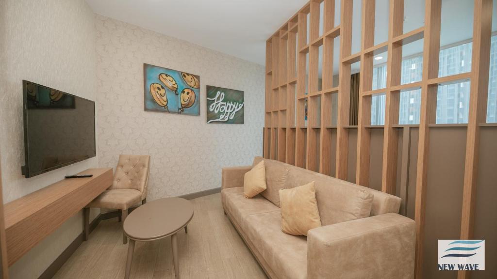 TV a/nebo společenská místnost v ubytování New Wave Hotel