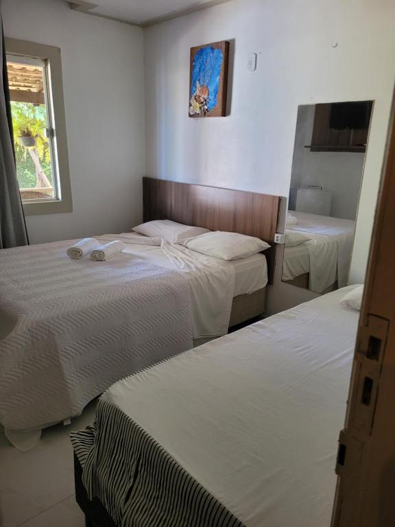 Postel nebo postele na pokoji v ubytování Pousada Recanto do Sal