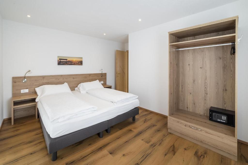 Postel nebo postele na pokoji v ubytování Apartments Gasser