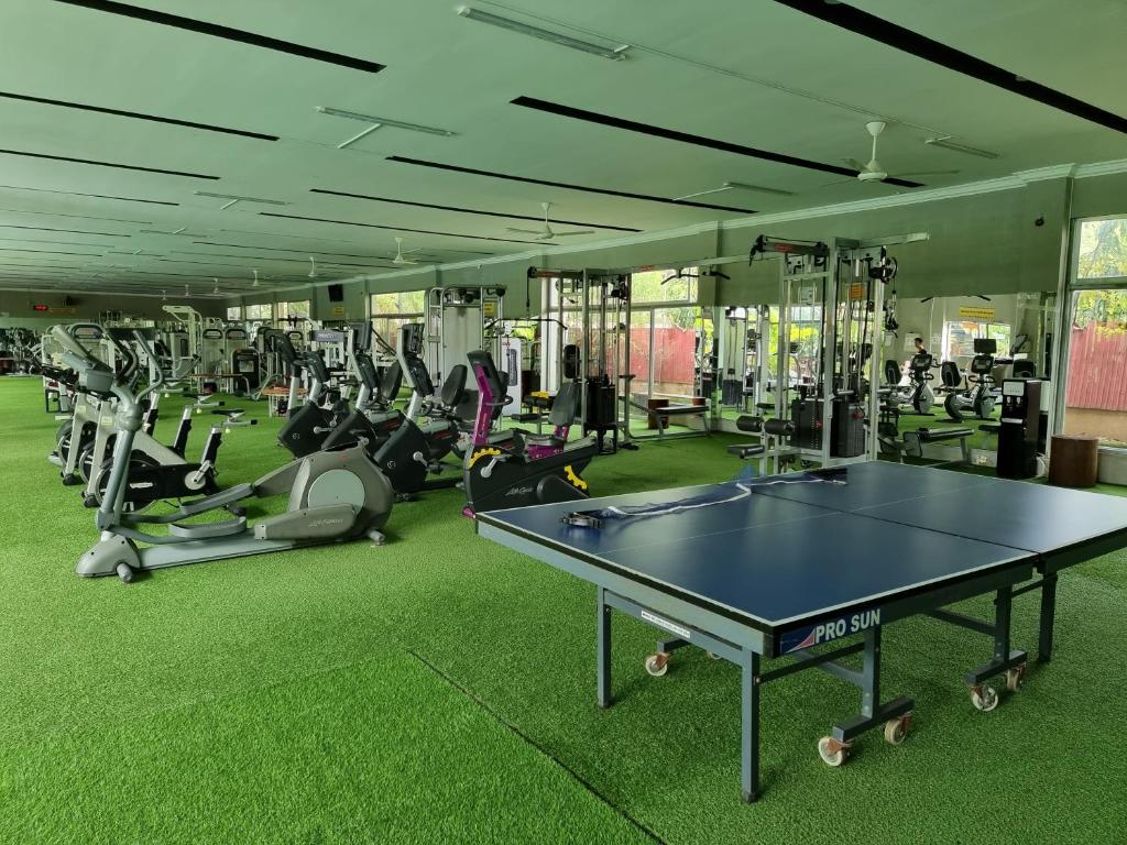 a gym with a ping pong table in the middle at STAY SWEET in Phnom Penh