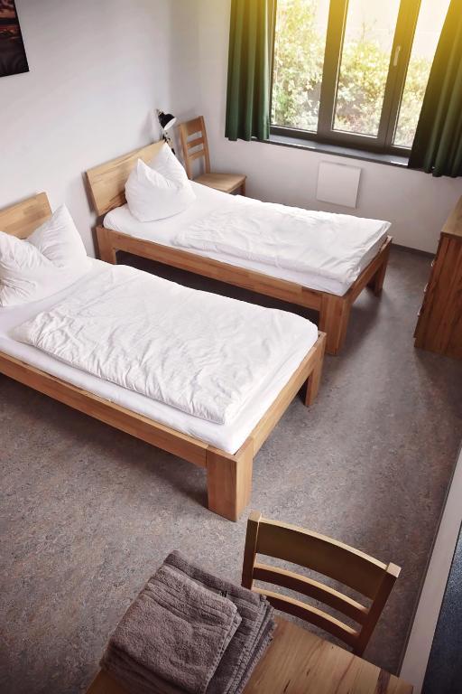 Postel nebo postele na pokoji v ubytování Hotel Garni Fischerfleck in Ismaning near Munich