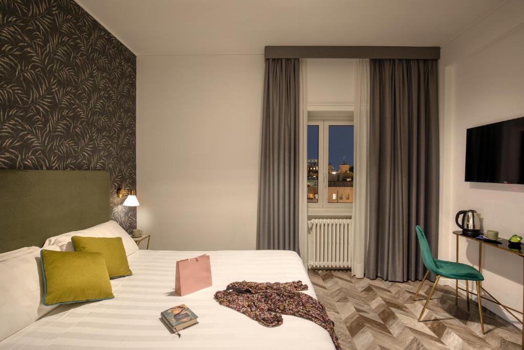 Postel nebo postele na pokoji v ubytování Bloom Hotel Rome