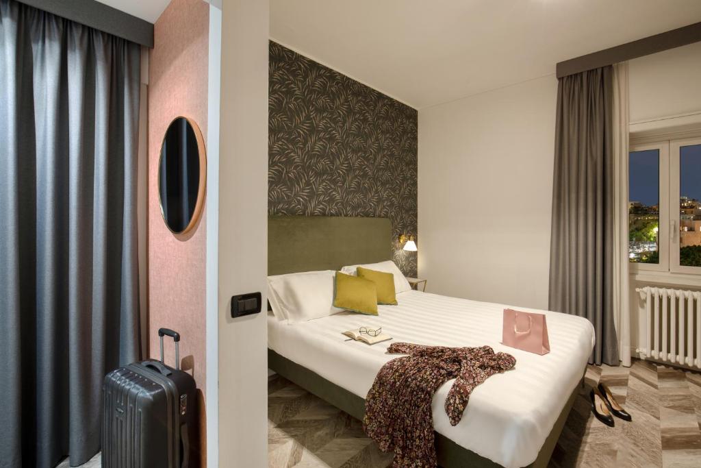 Postel nebo postele na pokoji v ubytování Bloom Hotel Rome