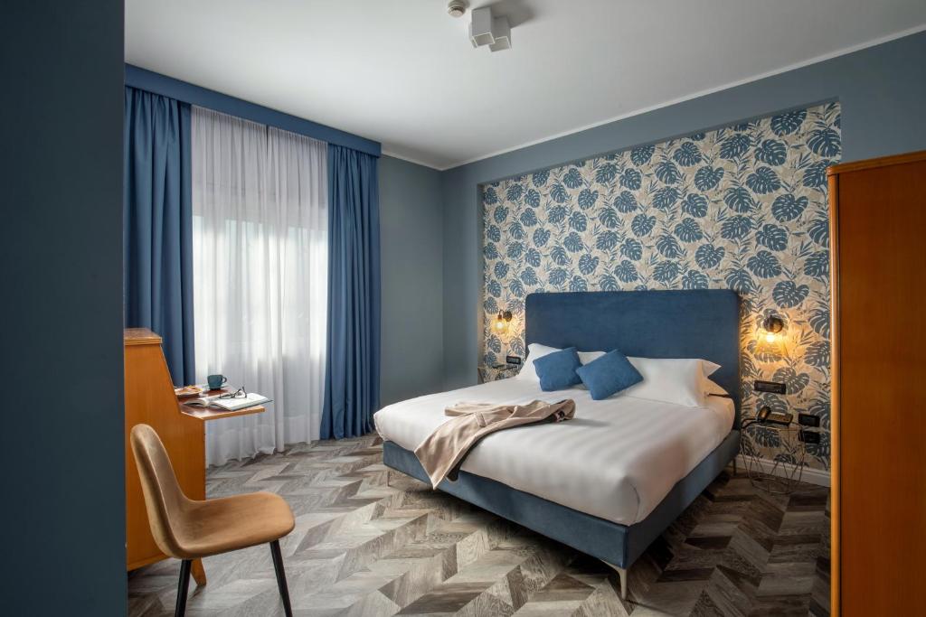Postel nebo postele na pokoji v ubytování Bloom Hotel Rome