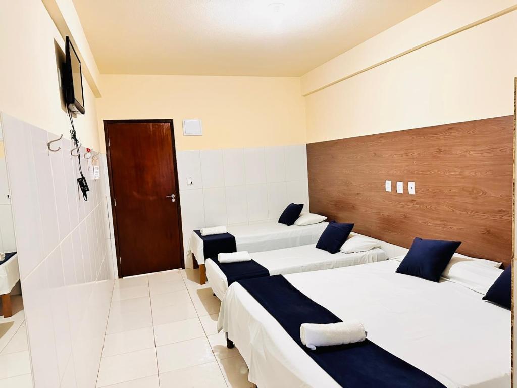 Postel nebo postele na pokoji v ubytování Infinity Pousada